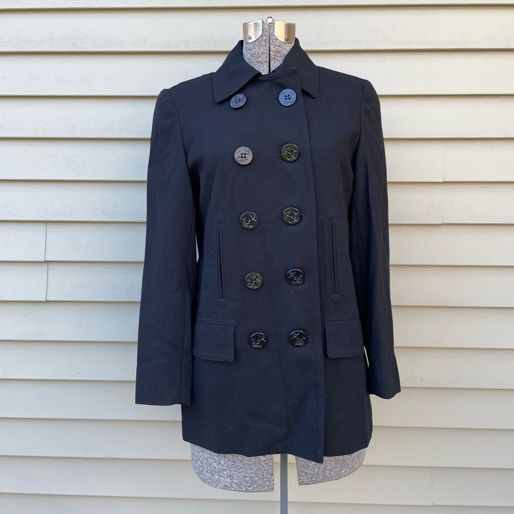 Black Dbl Breasted 100 % Wool original tags sleeves 23” long and coat length 29”